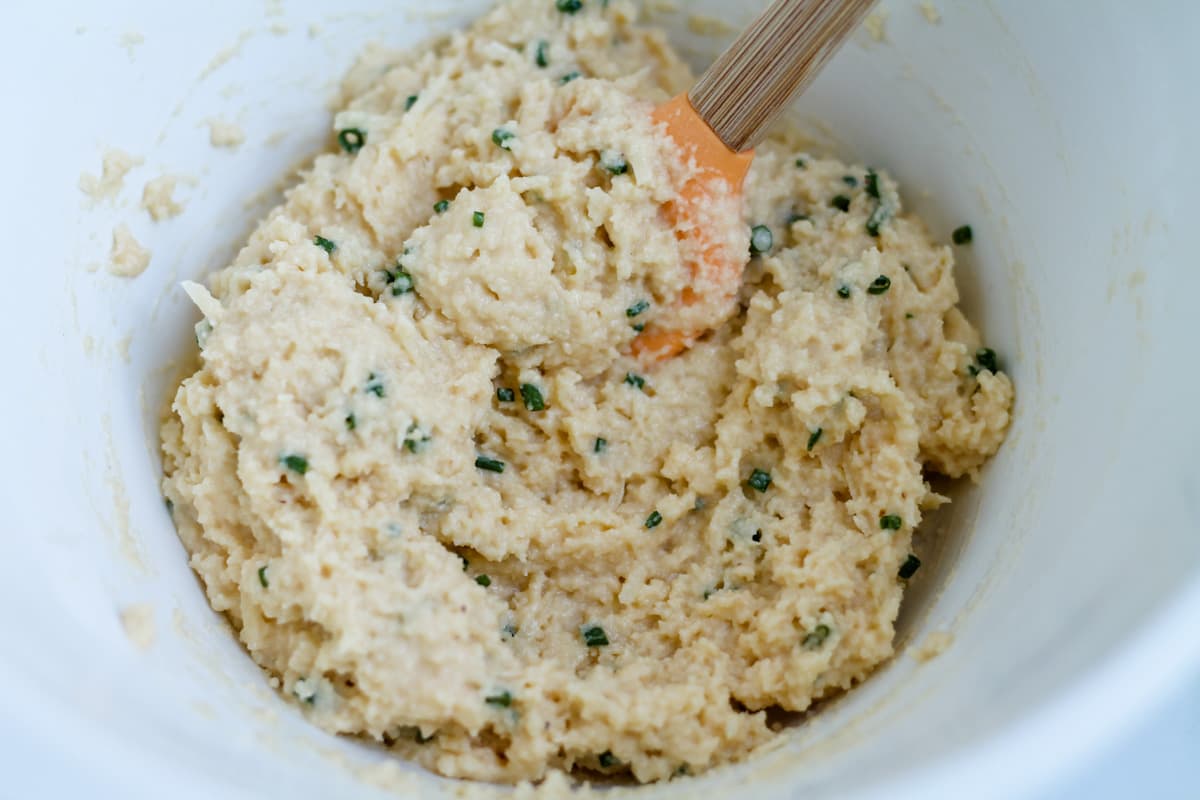 Ingredients being stirred in a bowl.