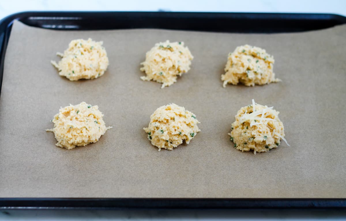 Biscuit dough on a baking sheet.