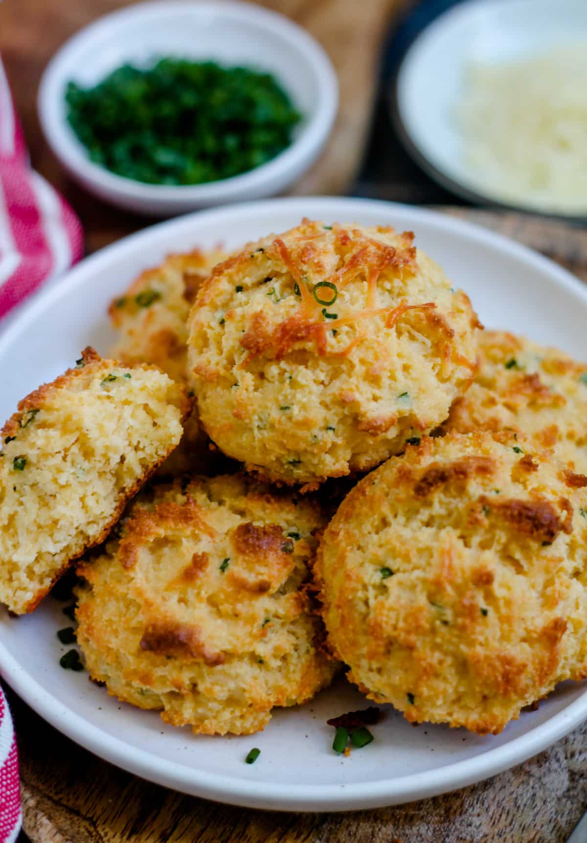 A plate of parmesan chive almond flour biscuits.