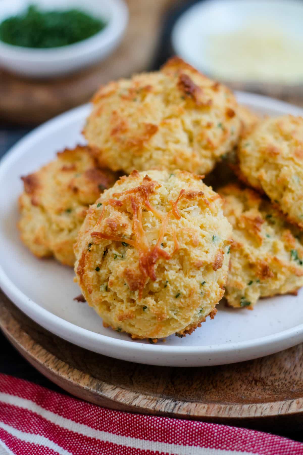 A plate of parmesan chive almond flour biscuits.