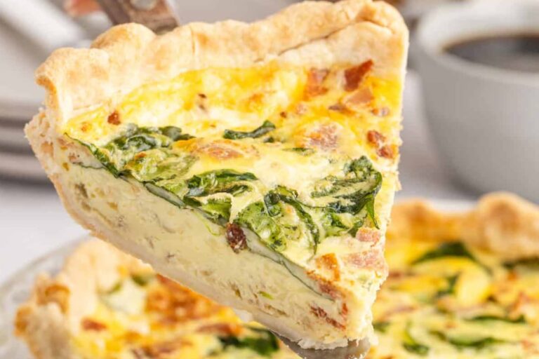 A plate of Spinach and Bacon Quiche.