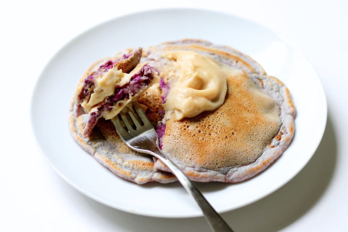 A plate of Vanilla Purple Sweet Potato Pancakes.