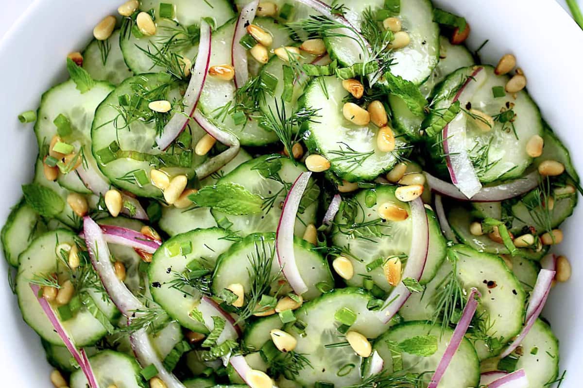 A bowl of Herbed Cucumber Salad.