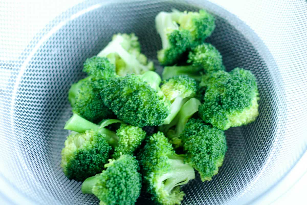 Broccoli in a strainer.