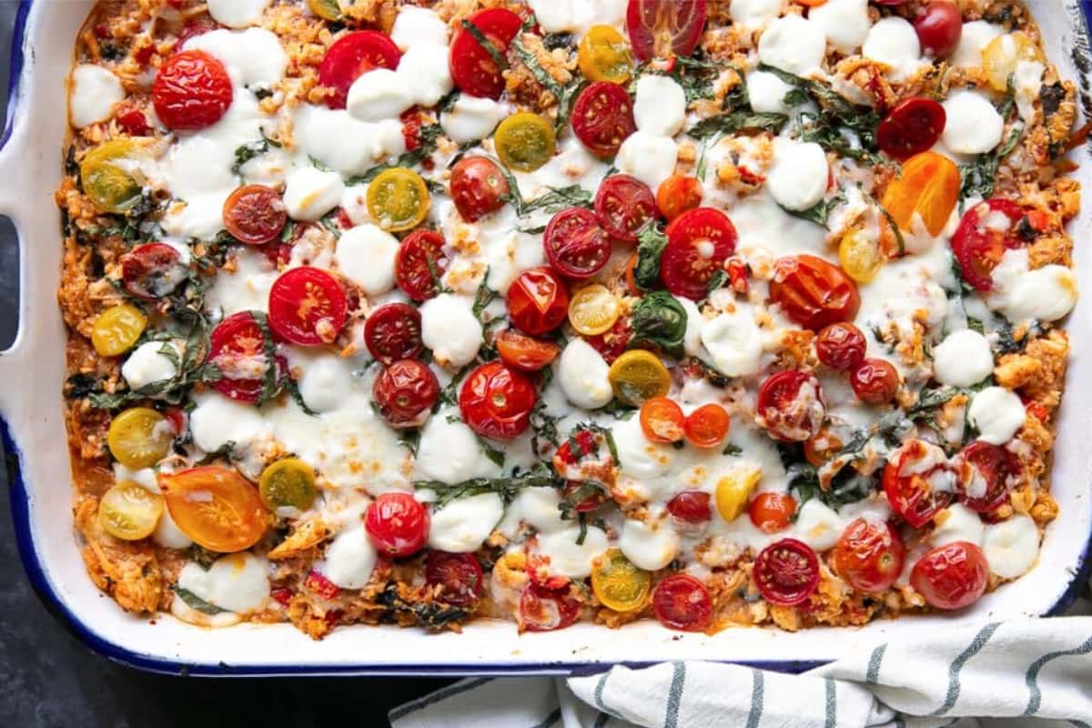 A dish of Cheesy Chicken Caprese Casserole.