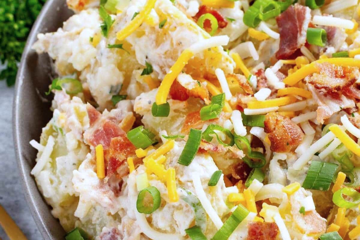 A bowl of Loaded Potato Salad.