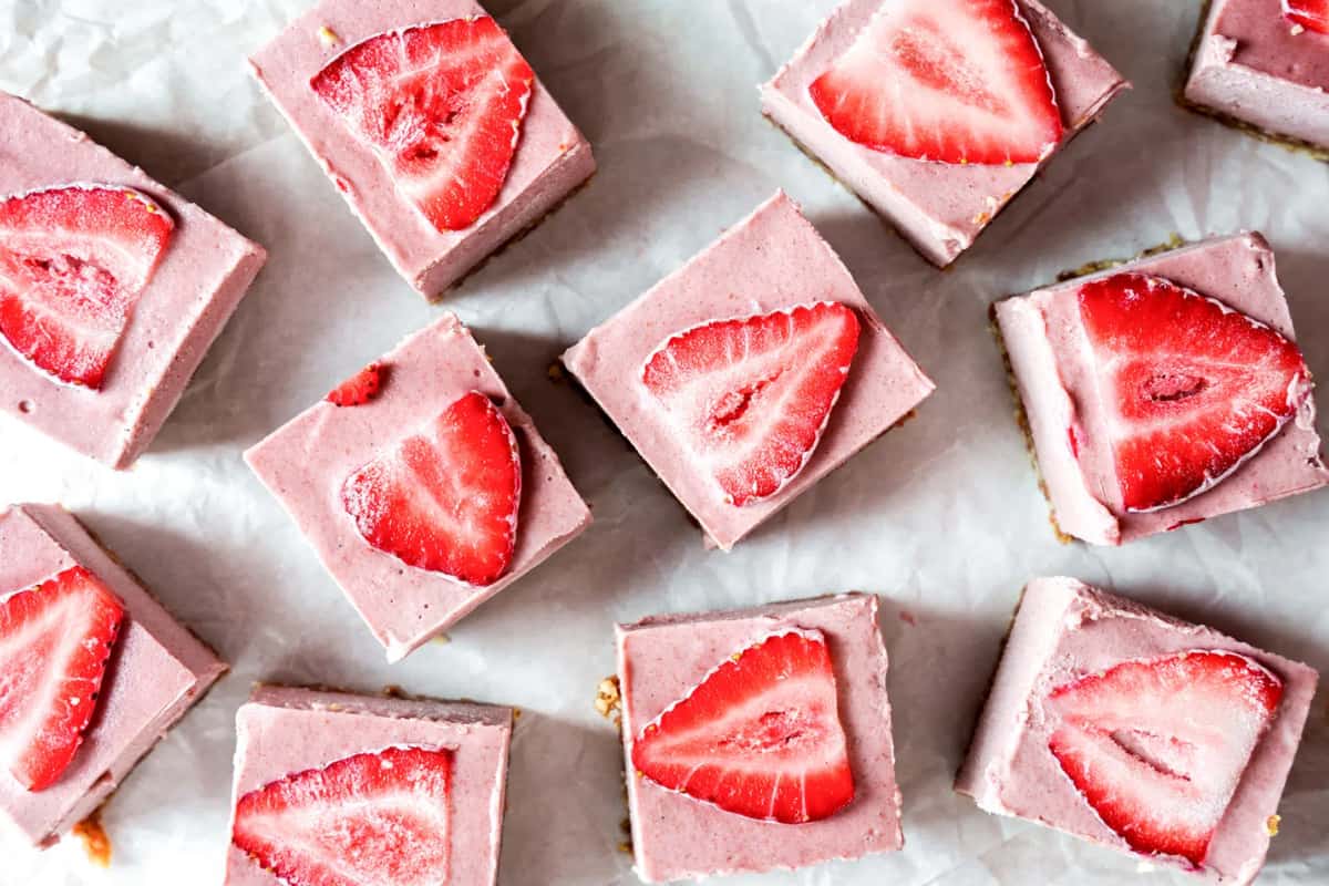 A plate of No-Bake Vegan Strawberry Cheesecake Bars.