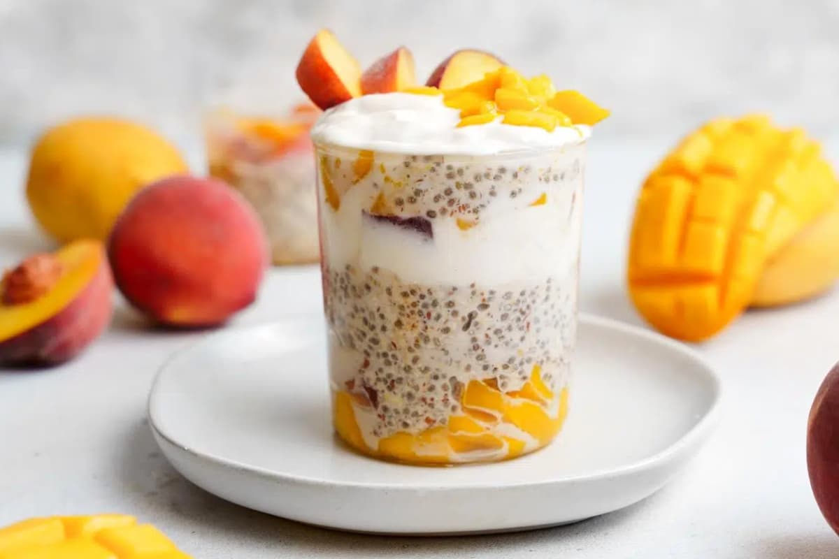 A jar of Creamy Peach Mango Overnight Oats.
