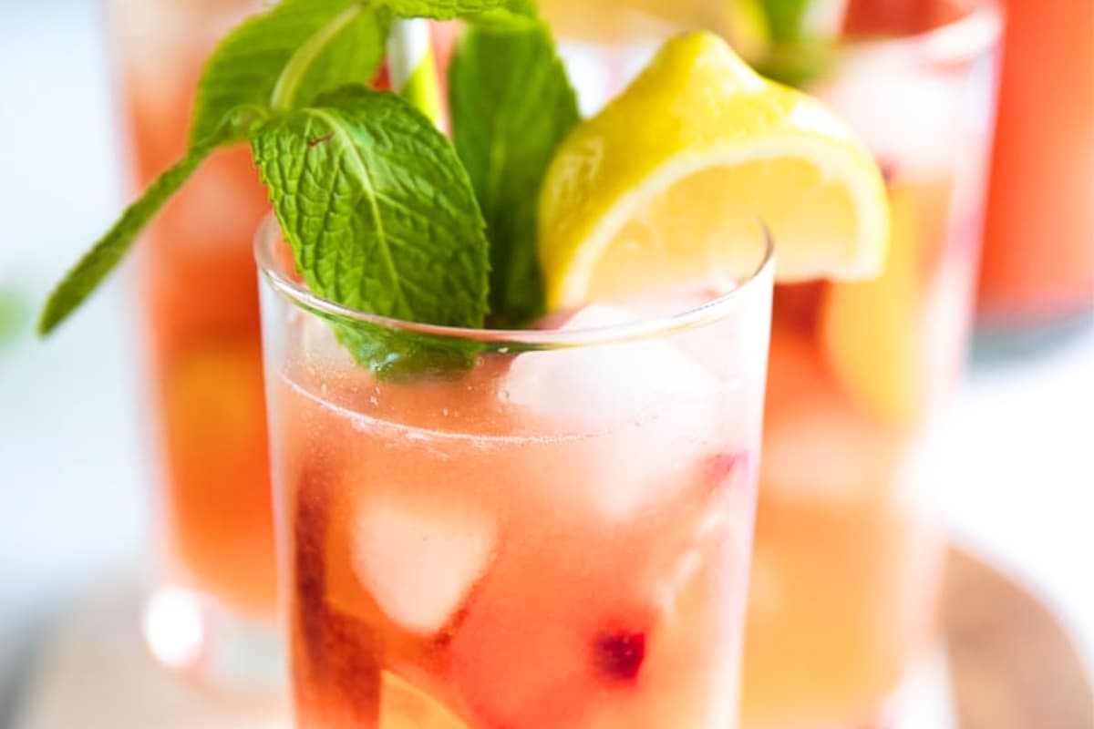 A glass of Peach Strawberry Lemonade.