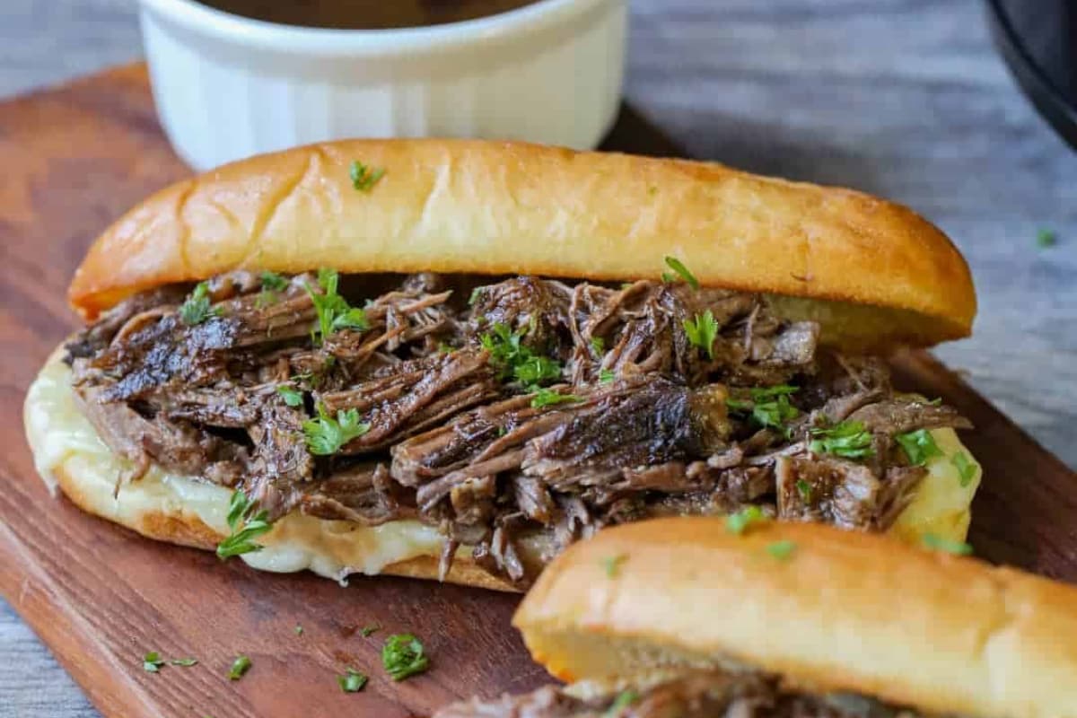 A platter of Easy Slow Cooker Pulled Beef for Sandwiches or Tacos.