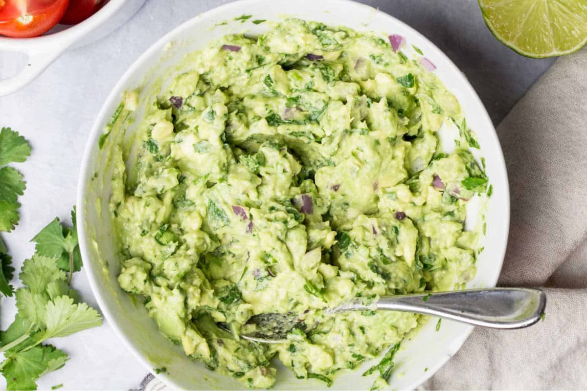 A bowl of Easy Guacamole Recipe (5 Minute).