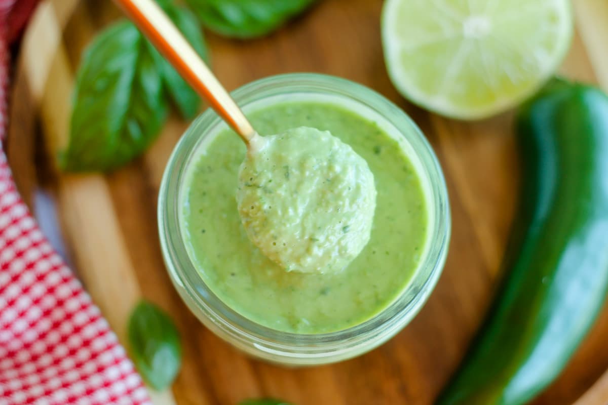 A jar of spicy basil sauce.