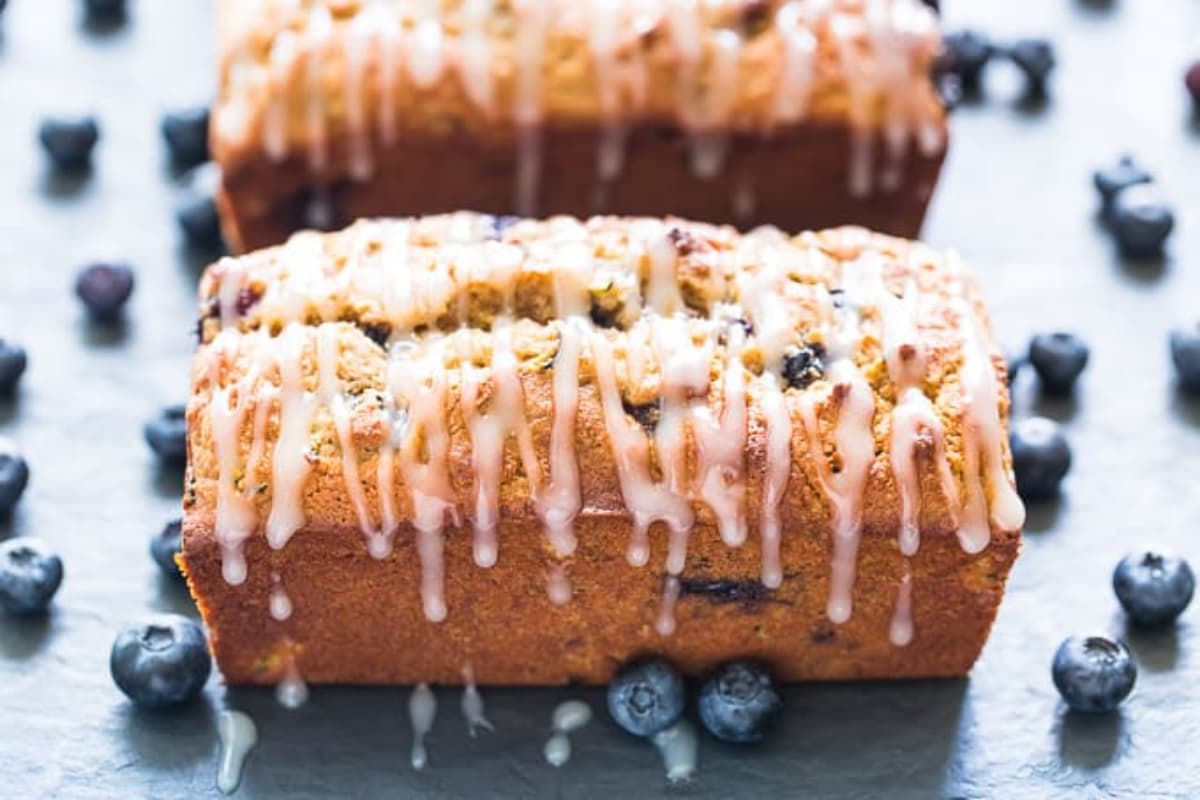 A tray of Zucchini Blueberry Bread with Lemon Glaze.