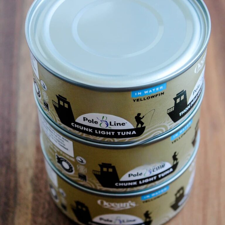 Cans of tuna on a counter.