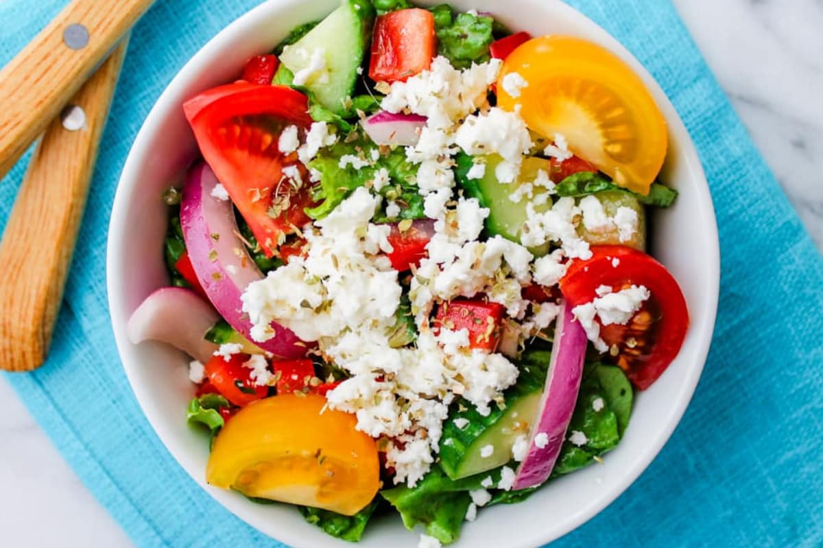 A bowl of Cucumber and Tomato Salad with Feta Cheese.