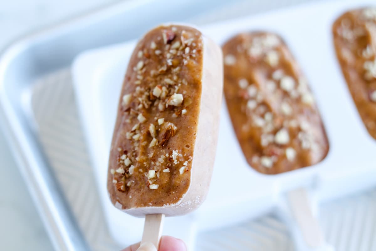 A bar being popped out of a popsicle mold.