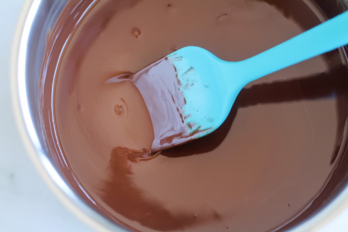 Chocolate being melted in a saucepan.