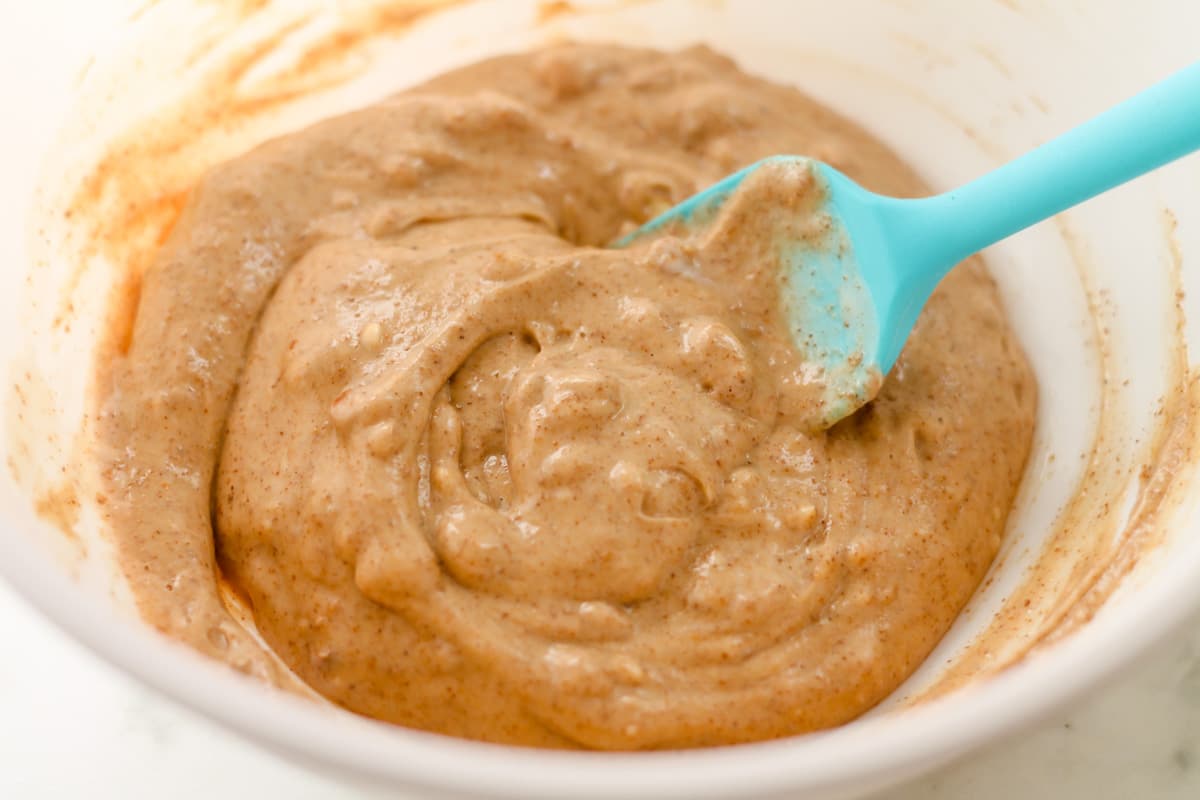 Ingredients being stirred in a bowl.