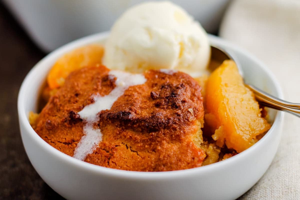 A bowl of Almond Flour Peach Cobbler .
