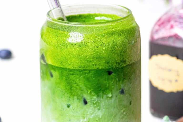 A glass of Iced Blueberry Matcha Latte.