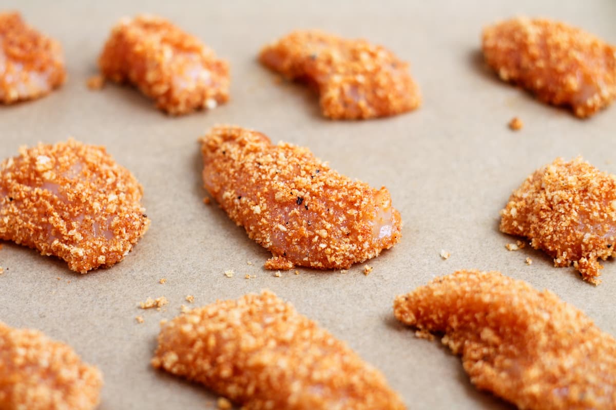 Breaded chicken on a tray.
