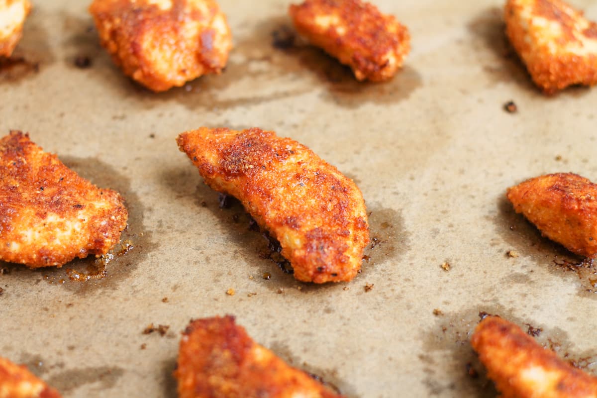 Cooked nuggets on a tray.