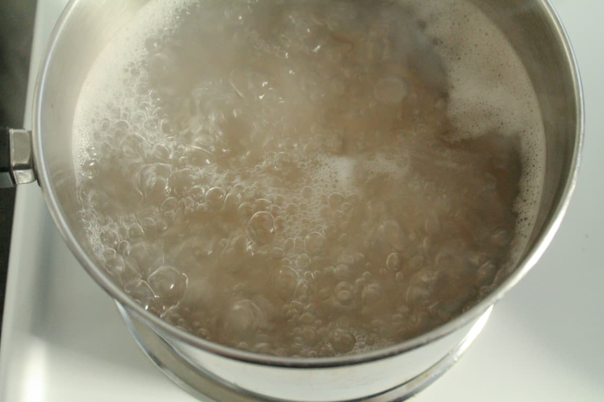 A pot of pasta water on the stove.