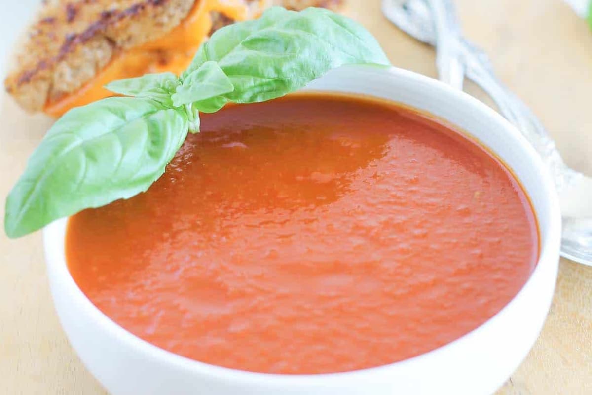 A bowl of Roasted Tomato Basil Soup.