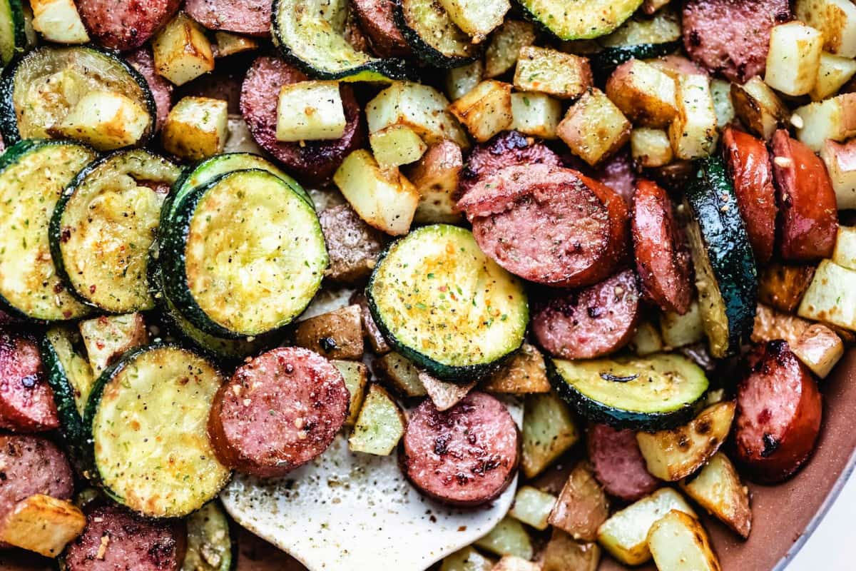 A dish of Skillet Kielbasa Zucchini and Potatoes.