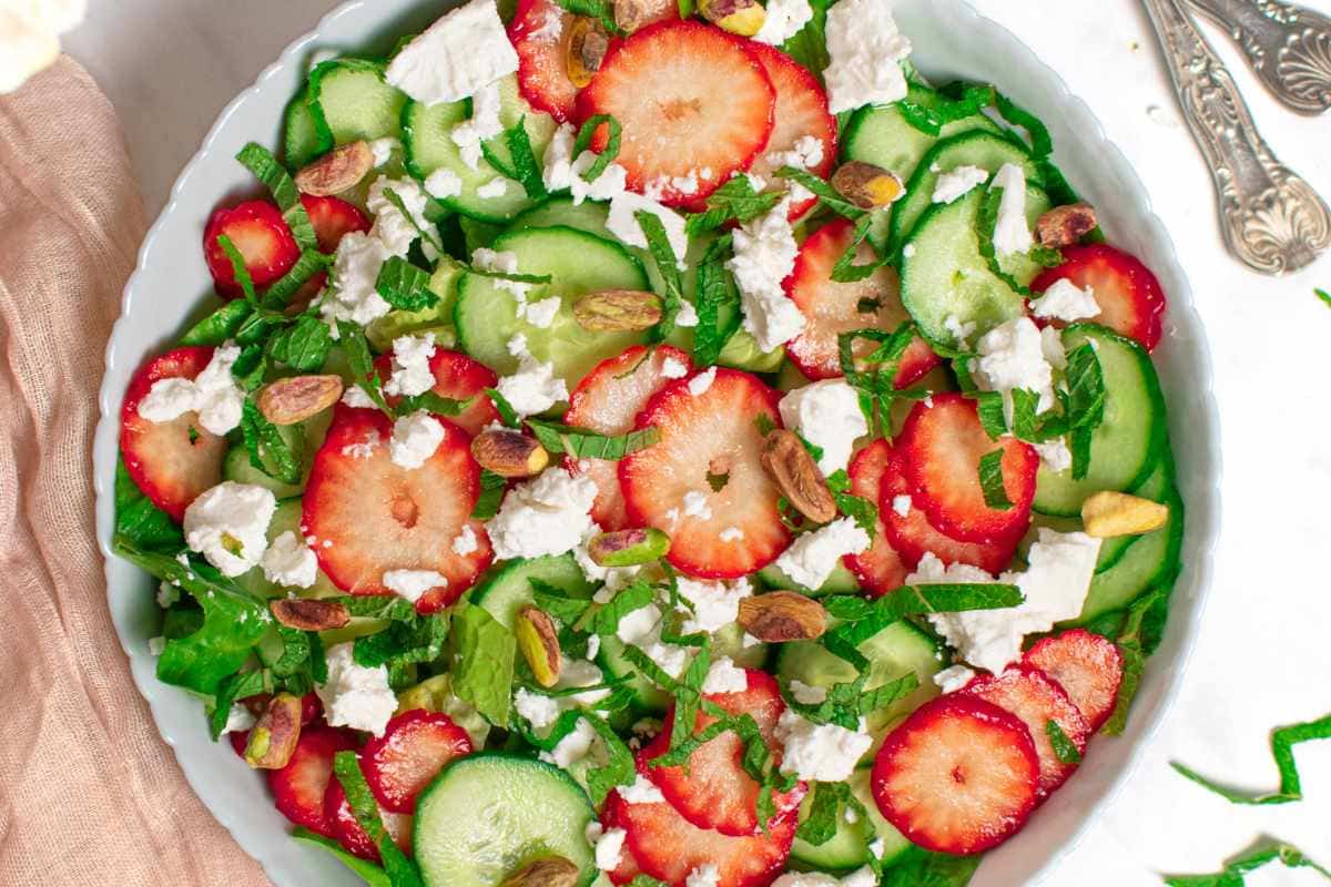 A bowl of Strawberry Cucumber Salad with Feta and Mint.