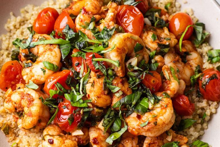 A bowl of Citrus Lemon Basil Shrimp with Cherry Tomatoes.