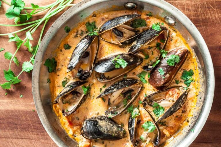 A dish of Red Thai Curry Mussels.