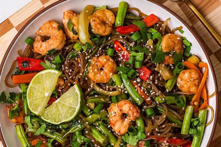 A dish of Sesame Scallion Noodles with Shrimp and Veggies.