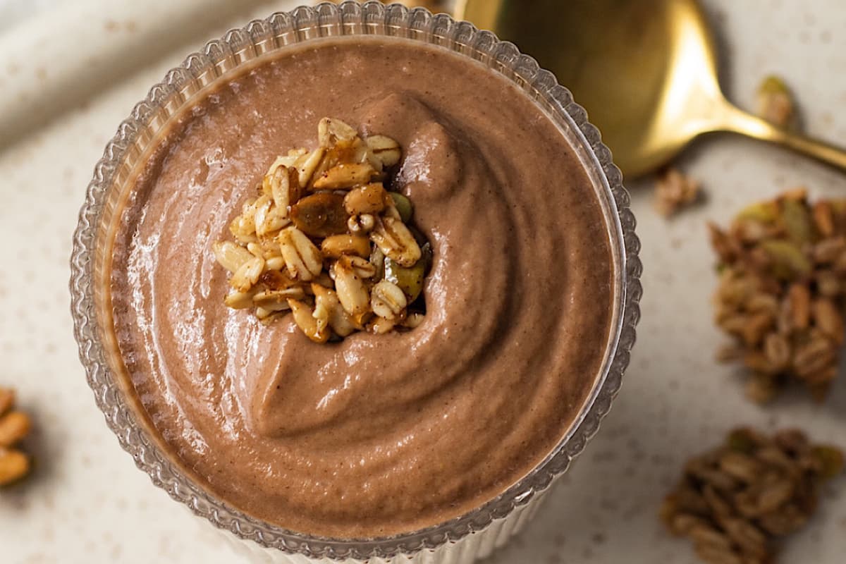 A glass of Chocolate Apple Pie Protein Smoothie.