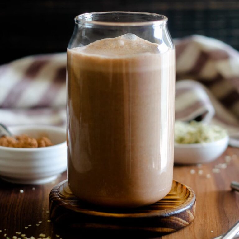 A glass of chocolate hemp milk.