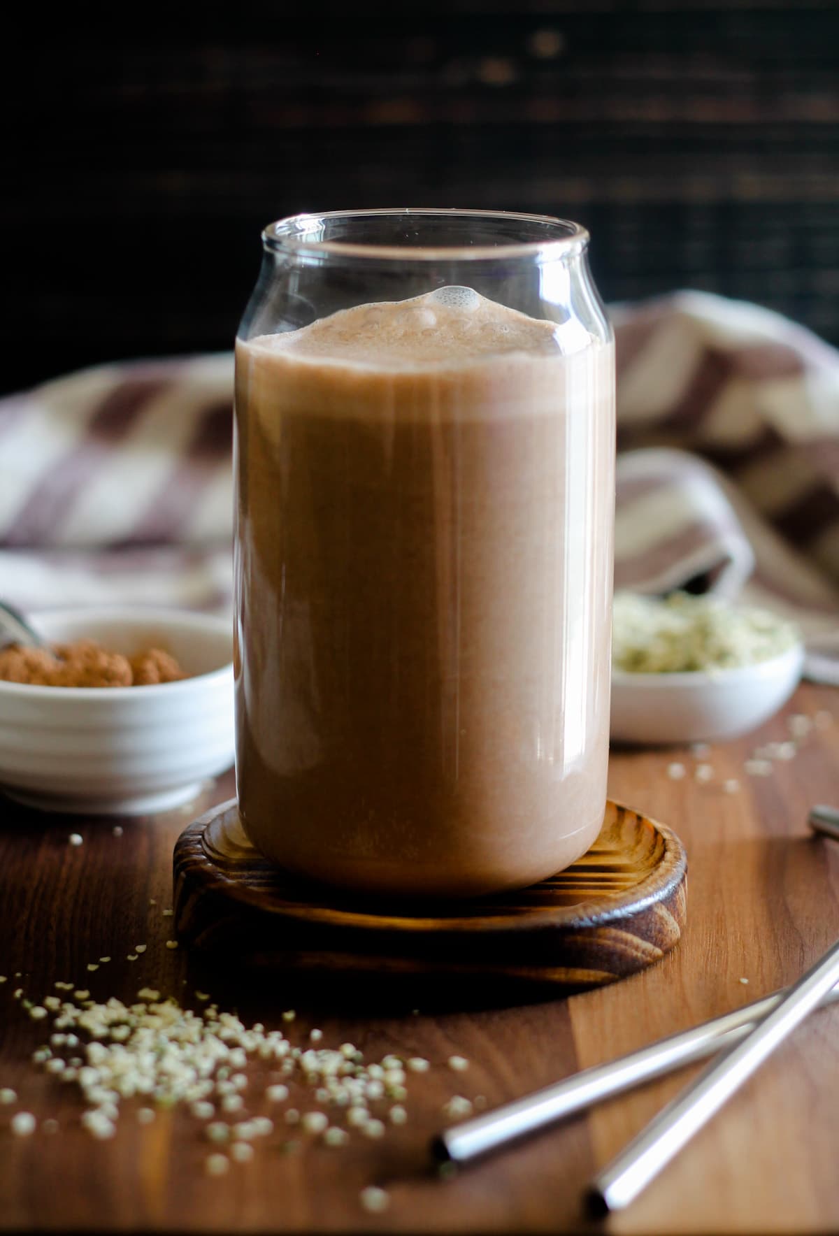 A glass of chocolate hemp milk.