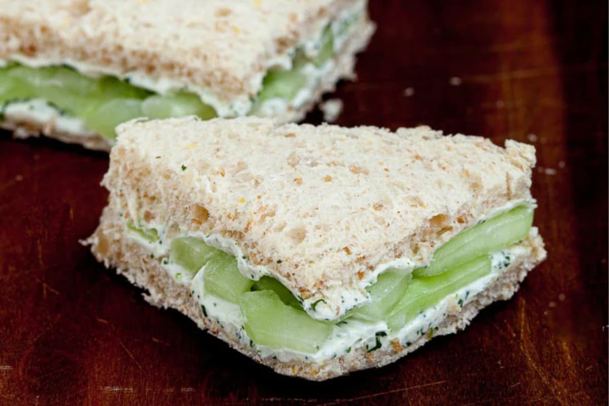 A plate of Cucumber Sandwiches with Cream Cheese and Lemon.