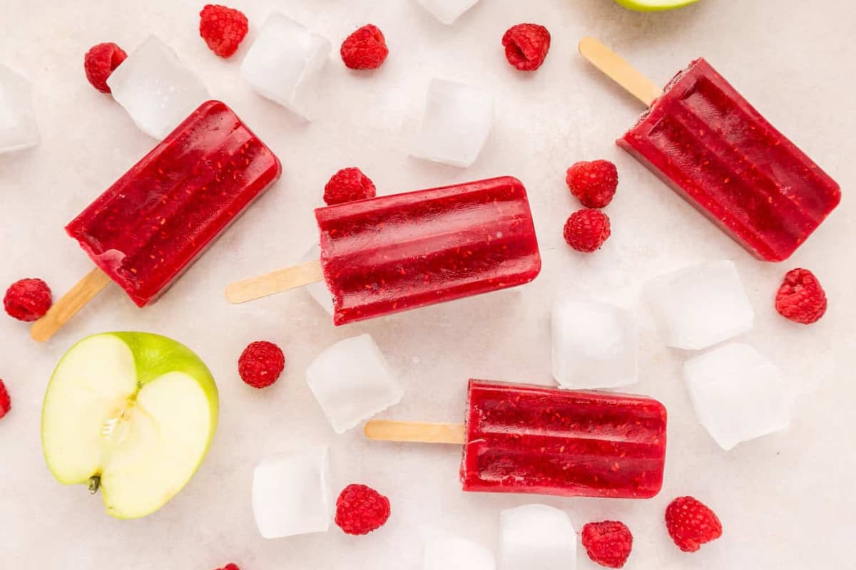 A dish of Raspberry Popsicles.