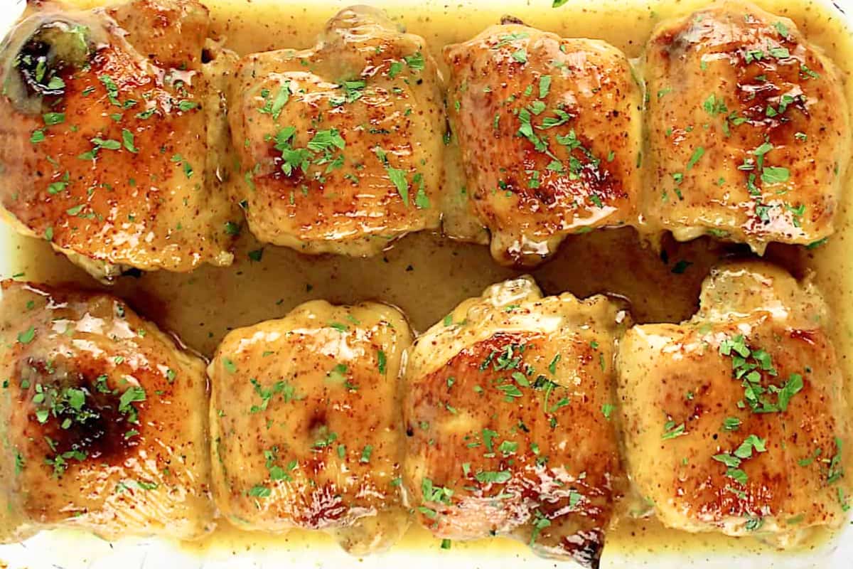 A dish of Honey Mustard Baked Chicken Thighs.