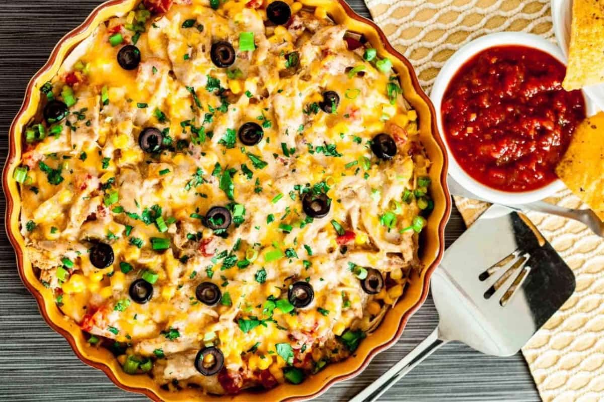 A dish of Healthier Chicken Enchilada Casserole.