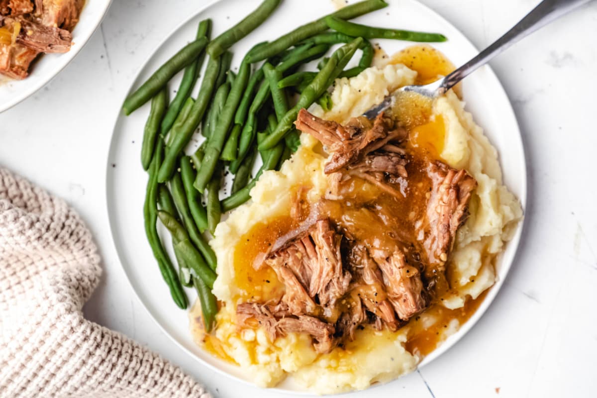 A plate of Instant Pot French Onion Pot Roast.