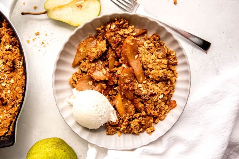 A dish of Fresh Pear Crisp with Cinnamon and Pecan Topping.
