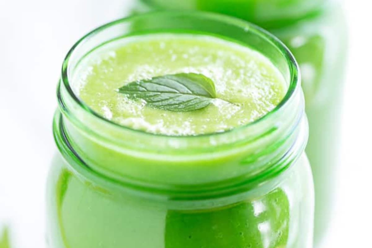 A glass of Pineapple Mint Green Smoothie.