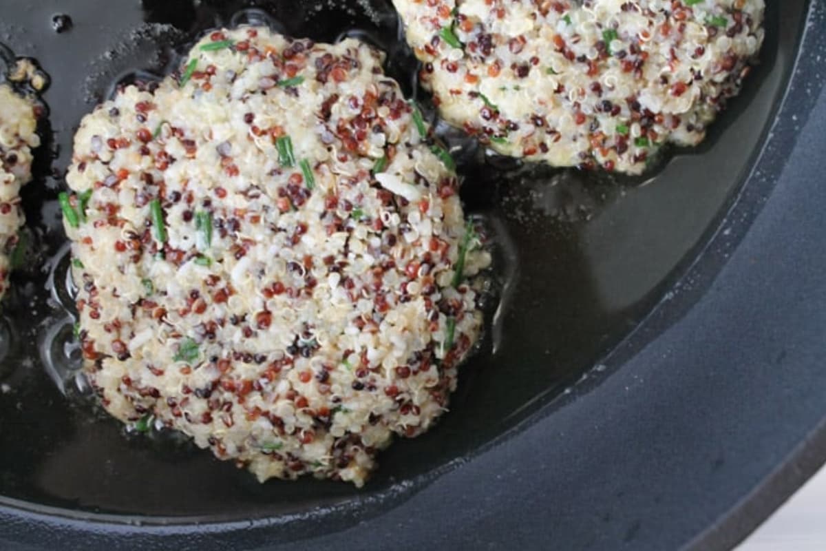 Quinoa cakes in a pan.