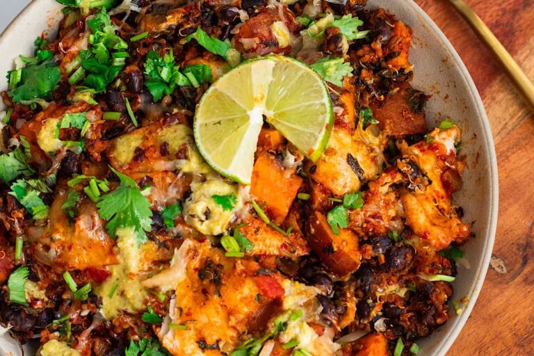 A bowl of One Pan Sweet Potato Black Bean Enchilada Skillet.