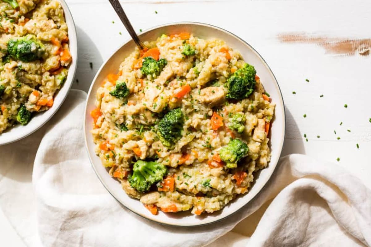 A plate of Cheesy Broccoli Chicken and Rice.