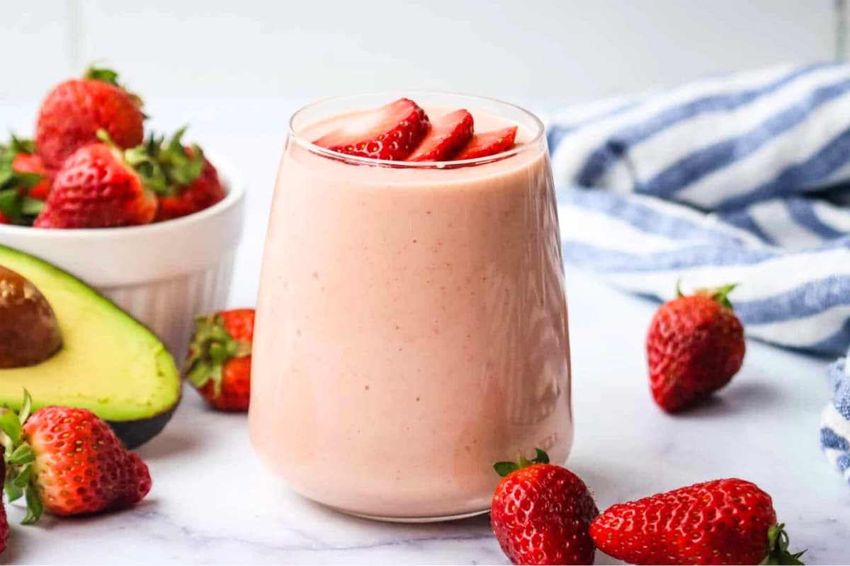 A glass of Avocado Strawberry Smoothie.