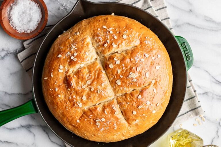 A skillet of honey oat bread.