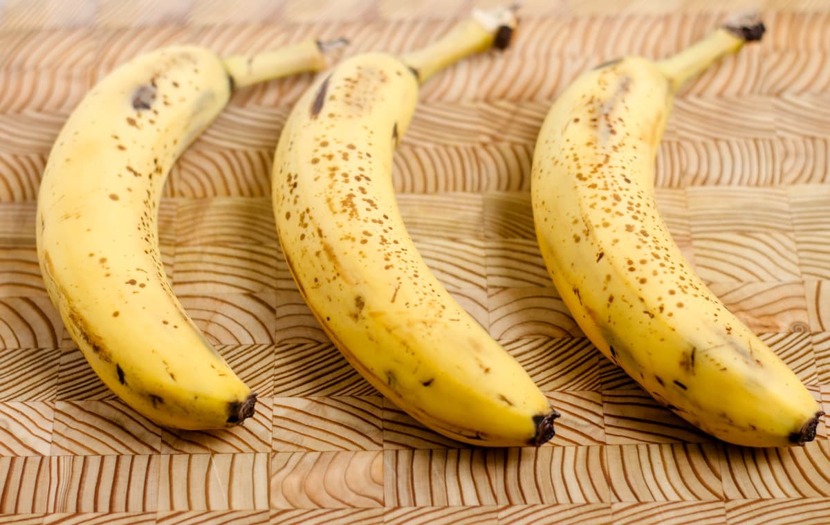 Ripe bananas on a counter.