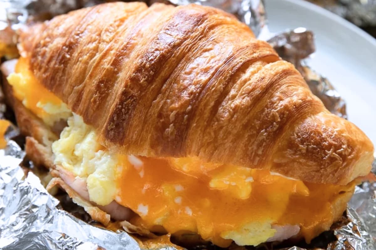 A plate of Croissant Breakfast Sandwich.